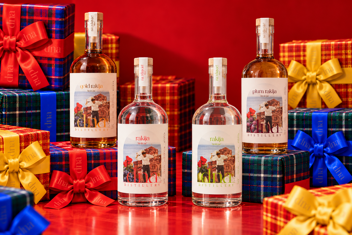 Classic, Gold, Pear and Plum rakija with colourful wrapped gifts.