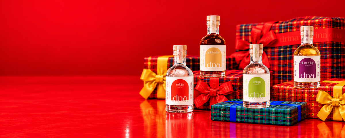 Classic, Gold, Pear and Plum mini rakija bottles on tartan Christmas gifts.