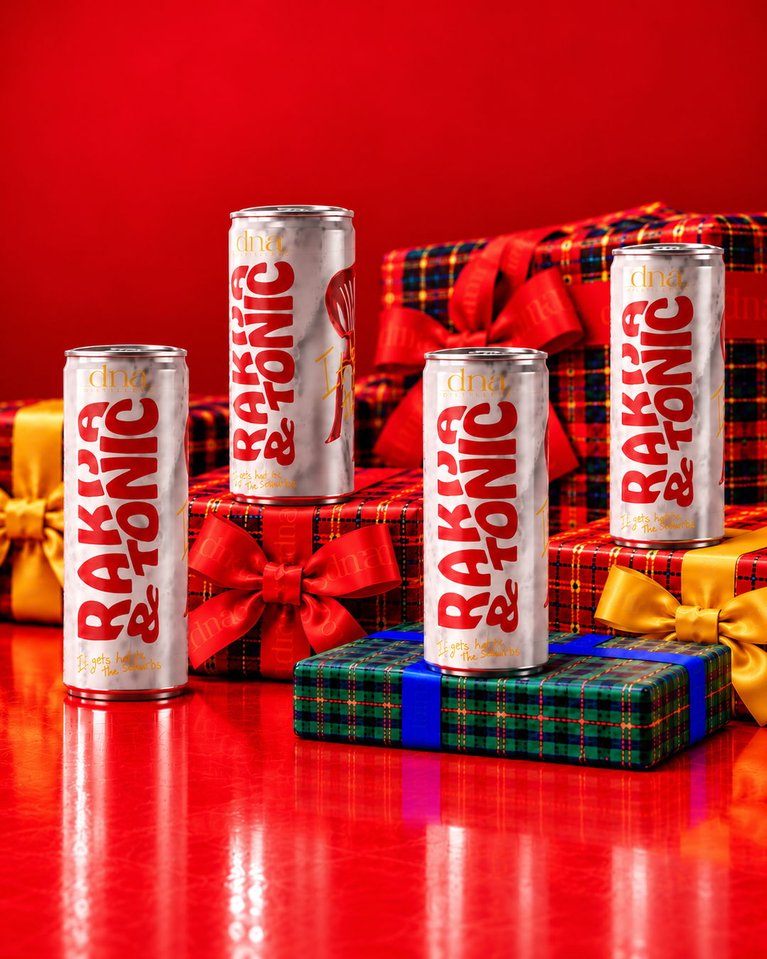DNA Rakija and Tonic cans with tartan Christmas gifts.