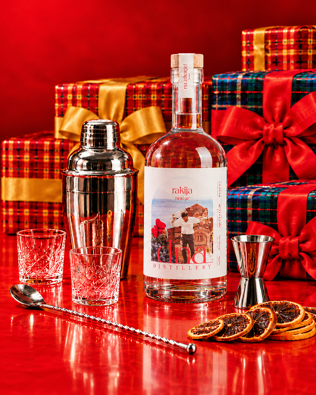 Classic rakija with silver cocktail tools and Christmas gifts.