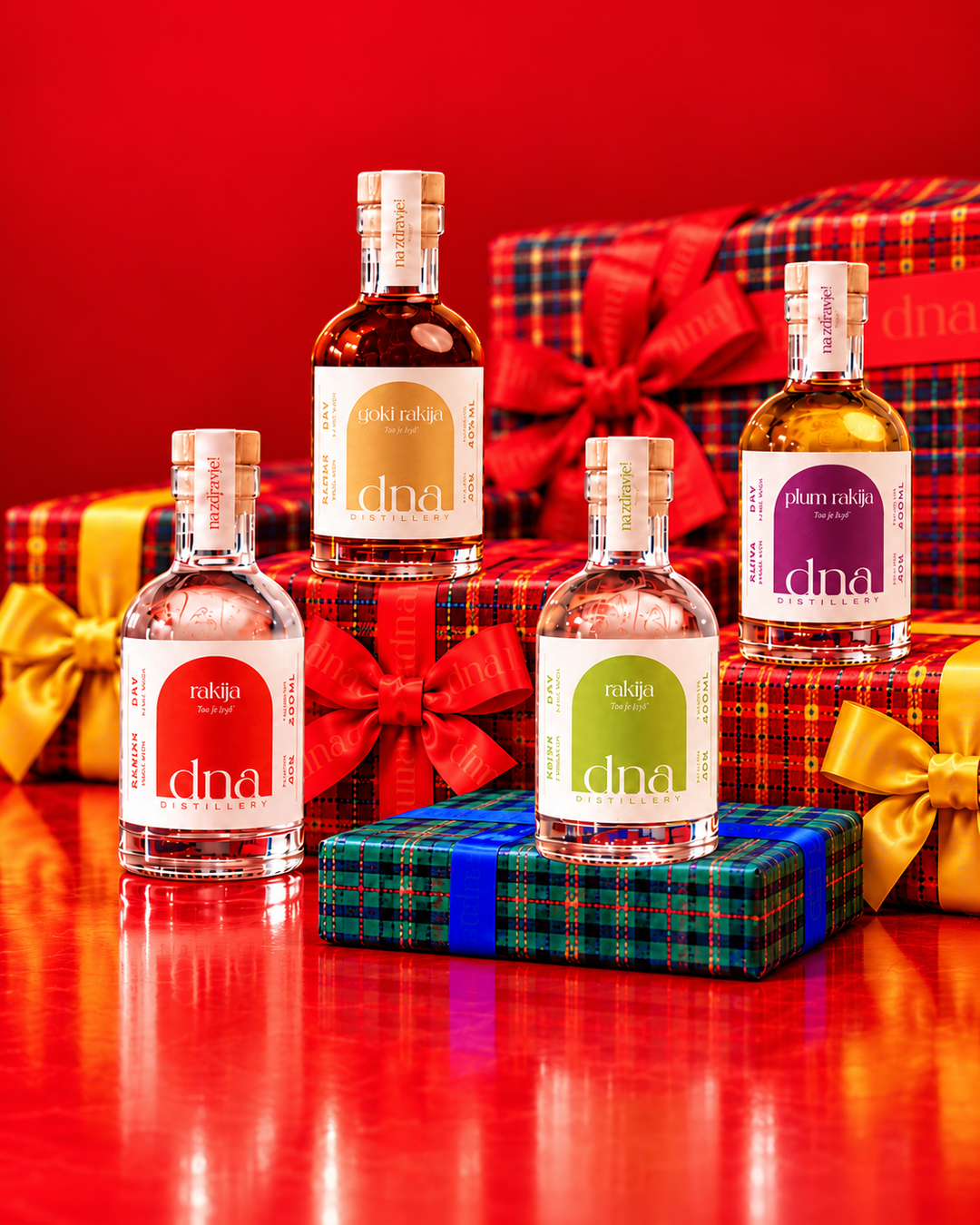 Four mini rakija bottles with Christmas gifts.